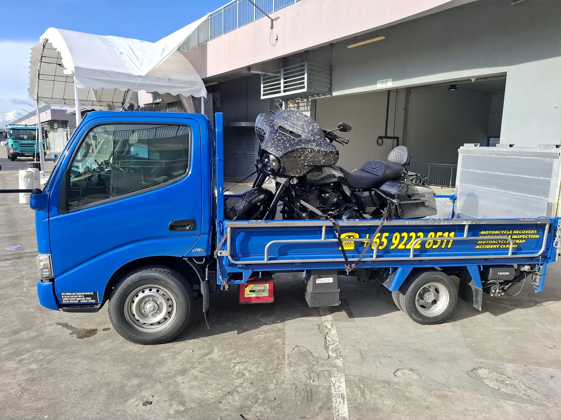 Motorcycle loaded on a Siva Towing lorry for breakdown recovery